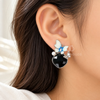 Blue-white butterfly dangle earrings with black faceted drops and pearl accents | SISTERHOODS-SHA256:8ec1d1ebdca3589d8d32a6703b326ece1317ced4e92853fa428e7ba686d5a574