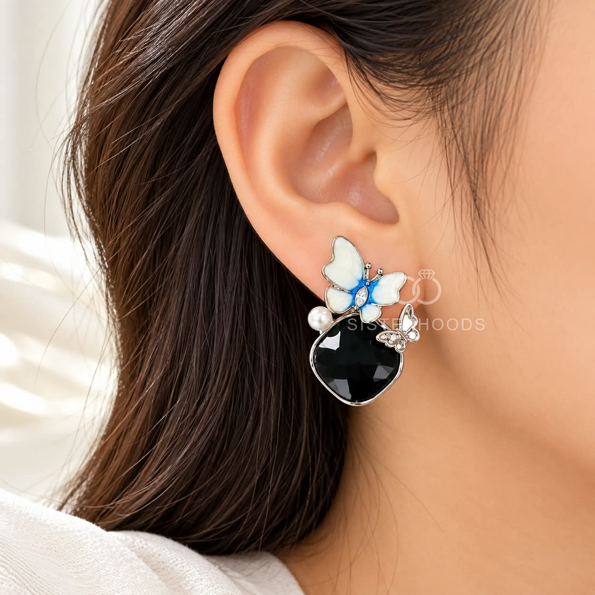 Blue-white butterfly dangle earrings with black faceted drops and pearl accents | SISTERHOODS-SHA256:8ec1d1ebdca3589d8d32a6703b326ece1317ced4e92853fa428e7ba686d5a574
