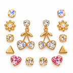 Gold-tone dangle earrings with faceted round accents, leafy details and twin heart charms | SISTERHOODS-SHA256:a29441d688a4cdf8c4d185e1a0cabd131b87ee0876990694775b7d134c73ecf7