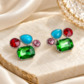 Multicolour faceted geometric cluster stud earrings with green, blue, red and pink accents | SISTERHOODS-SHA256:cdb0884a05c0650cf3367bee617f19010beda3ed6dd8ef572b30904e32e3fb80