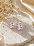 Pink fan-shaped dangle earrings with pearl and faceted accents | SISTERHOODS-SHA256:c9a3a0712de1a6113a0f7b3a0fd2e265ada0fb8d9f135fcafc5853f3ceaf2e3a