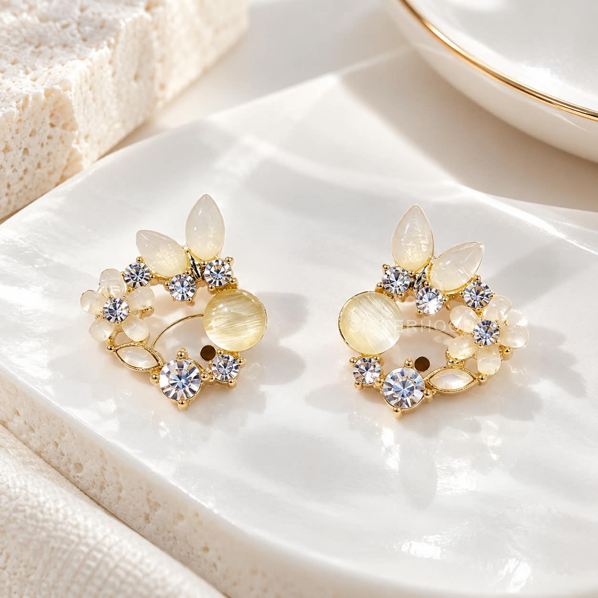 Gold-tone floral cluster stud earring with white petal shapes and sparkling round accents | SISTERHOODS-SHA256:ce09570b8e9d21a332a64b8b4fdd8758f42b8e25aa9a80e3d8f3f5281a01c7cd