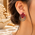 Red floral oxidized dangle earring with layered circular hoops | SISTERHOODS-SHA256:906820b9458f3b1aca14951f64687f8e07bd61237e649a2c0361a4b5f32dc905