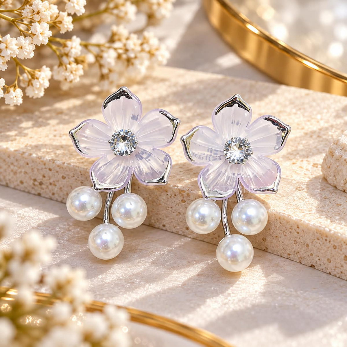 White flower-shaped dangle earring with three pearl drops and a sparkling centre | SISTERHOODS-SHA256:0b3ebba65ff043e03adc13effc43547dff68d98eb4a5a7f4c38a86871ea97376