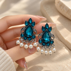 Blue teardrop oxidized dangle earrings with floral detailing and pearl accents | SISTERHOODS-SHA256:2c05004d5ef640effc93d6012583ee9488817f28bd40969afd995ded060bc2bc