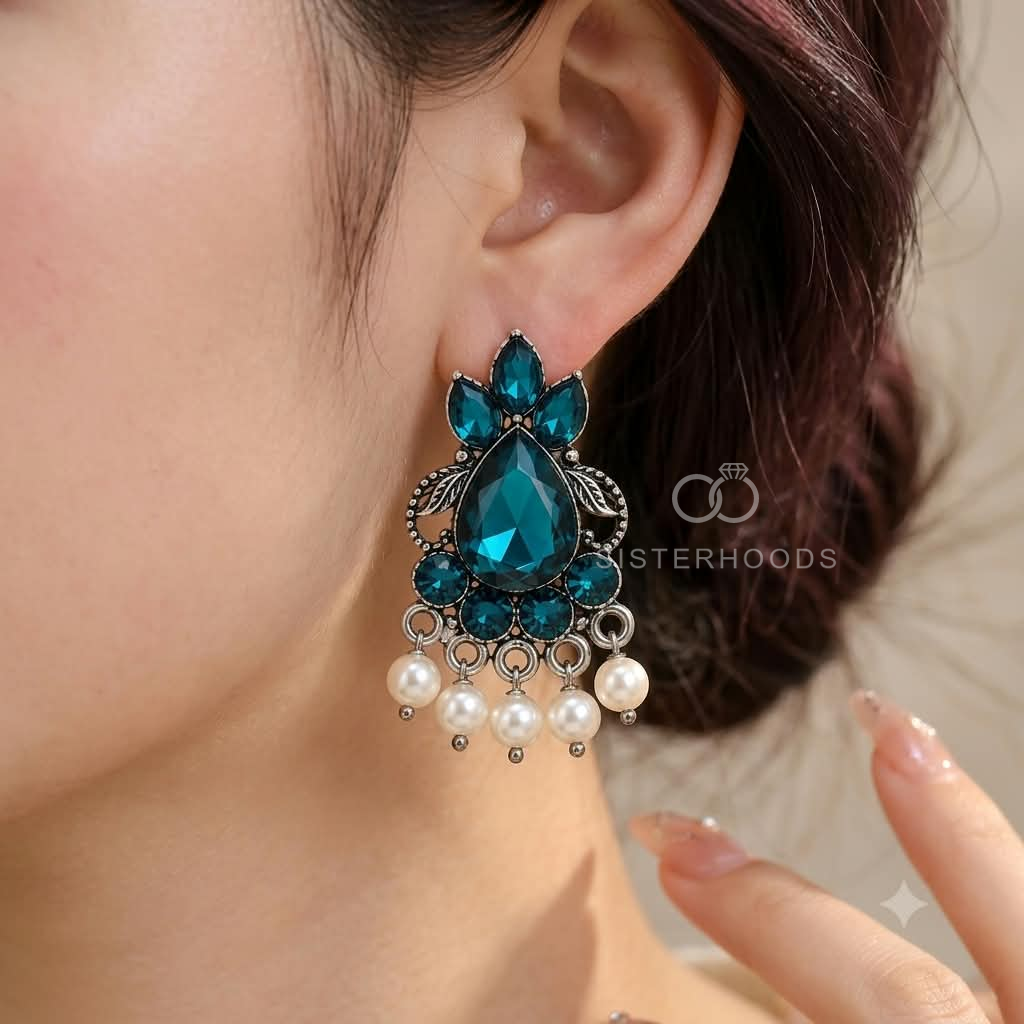 Blue teardrop oxidized dangle earrings with floral detailing and pearl accents | SISTERHOODS-SHA256:e58cd6baec7667aa2a77b3ba468d49f2455e0fdca78fb2dbf8b30ef8ca30377f