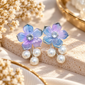 Pastel blue and lilac floral earrings with sparkling centres and three white pearl drops each | SISTERHOODS-SHA256:a2135800881291f734a045205b0a46bfc04243b9e98a89e815f3c985bbffa3c1