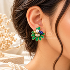 Green floral stud earrings with blue accents, pearl-like details and bee embellishments | SISTERHOODS-SHA256:7fe08135fcc08771d1e565413706f8fd3cc8deb2725981e0c55009a86da63393