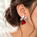 Colourful dangle earring with red faceted accent, white flower, pearl and butterfly charm | SISTERHOODS-SHA256:0d996f7c558e1977c4a6ee16804bb30956d6573475dc4f14185d5992bbf5648f