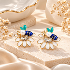 Multicolour bee and white flower stud earrings with turquoise and blue accents | SISTERHOODS-SHA256:fb6e64169b8ed20a30a16d3af54797b1a0677db6b699fd4042884c985cca5d7f