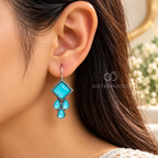 Turquoise geometric dangle earrings with square and teardrop accents | SISTERHOODS-SHA256:01ee4d87d5cf4a619b06168b81efbe8b7547d8772e329f22fc109e14b660a788