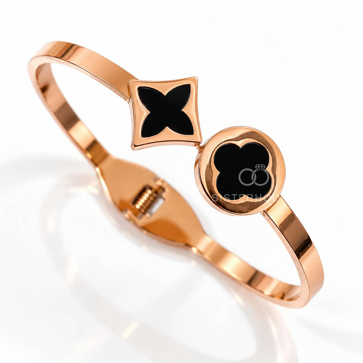Rose gold-tone cuff bracelet with black geometric motifs | SISTERHOODS-SHA256:e4fb08767f3dcafc53e2e7618d8450ea1202925acfa44c120ccf6ea8866ef23b