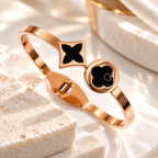 Rose gold-tone cuff bracelet with black geometric motifs | SISTERHOODS-SHA256:c0e69d1110737edab248e97462fa1dc8f2565354a27efe513d27d2690f555803