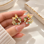Multicolour floral stud earrings with yellow, green and clear accents | SISTERHOODS-SHA256:dd4c0b7e2d5ef59d18c23d62a9273af1ad8d7d43c0dddc5d660d5bb8c3e960d0