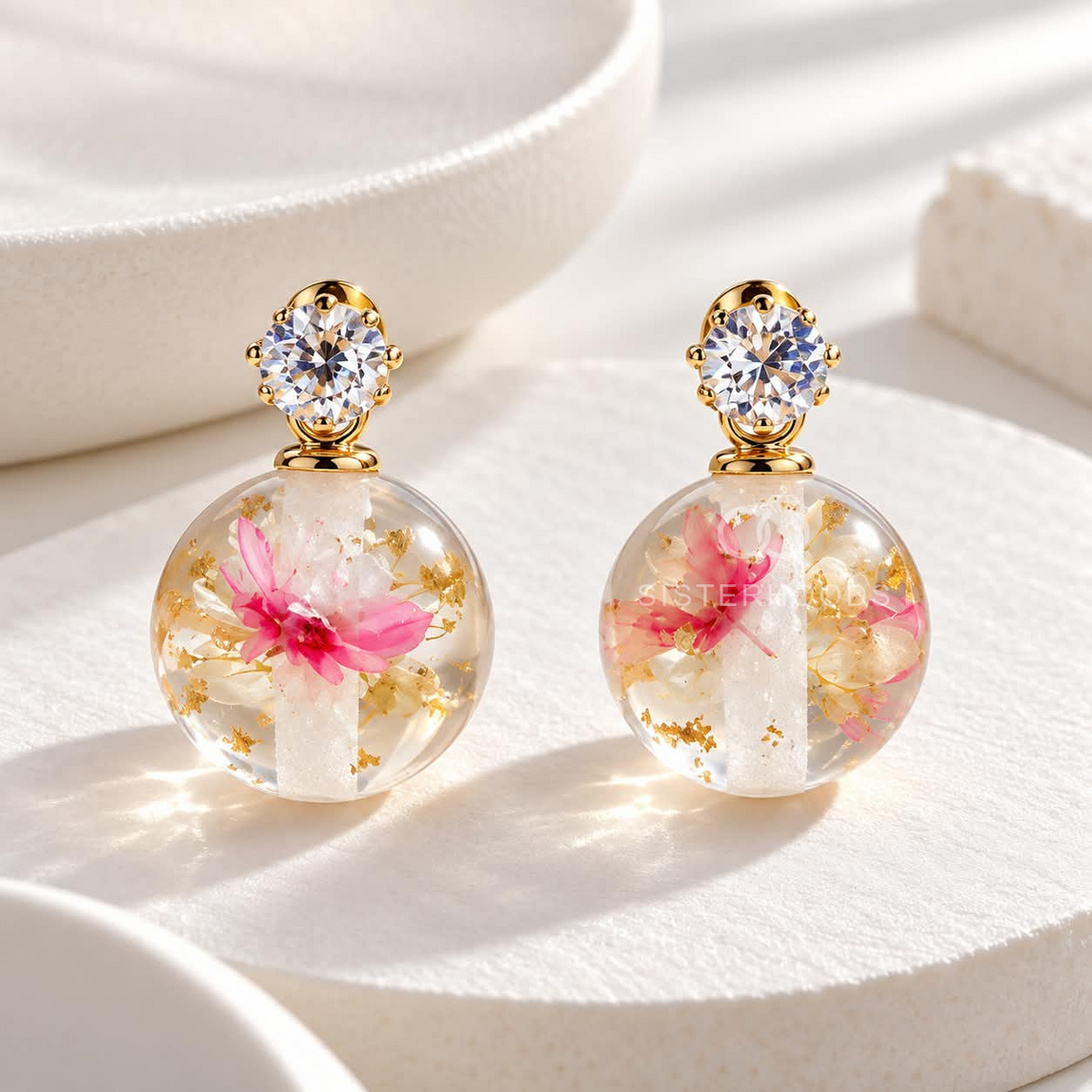 Round pink and white floral drop earring with crystal accent | SISTERHOODS-SHA256:3d22412fc224881ce983c8853772d612f9cafee06dbfdb5d2aa7448c1a7bc9f0