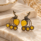 Oxidized peacock-inspired dangle earring with yellow accent stones | SISTERHOODS-SHA256:e570089bd14a644388f77a8a089ad0559a1d60b2e48a8c6007b3632e2f31d3a4