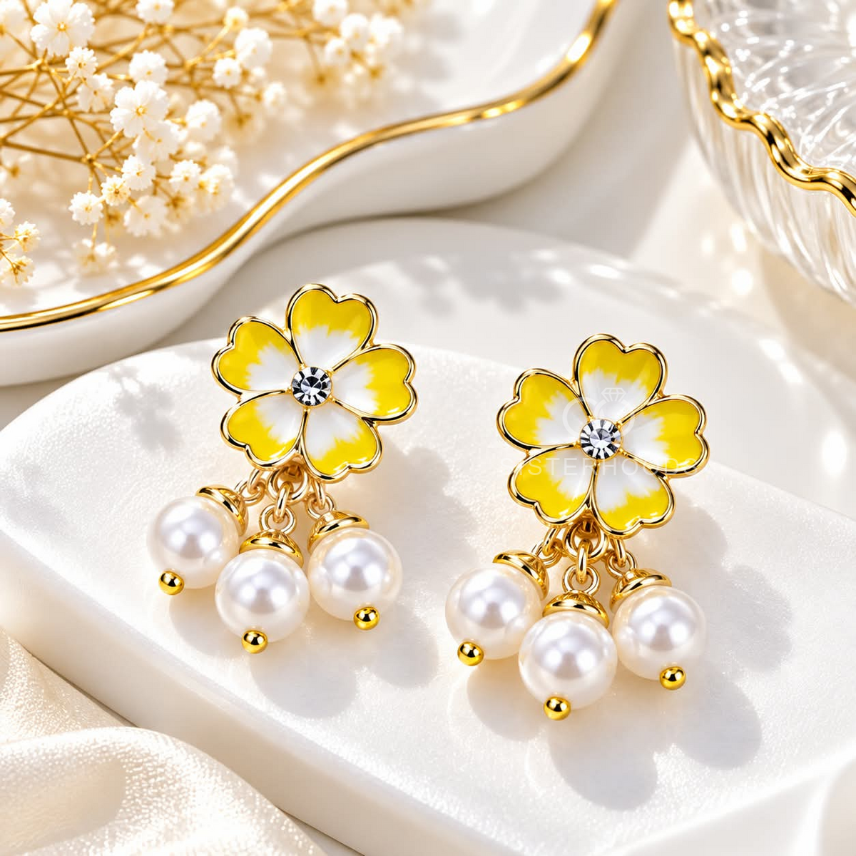 Yellow flower dangle earrings with white pearl drops and golden-coloured accents | SISTERHOODS-SHA256:89067a7d096151e3362afd3745b62726249e723b938d9b8b069b33468c291e14