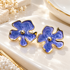 Blue floral stud earrings with gold-tone outlines and rounded petal details | SISTERHOODS-SHA256:842d612c4a128907ec8f7b859d080e08283e395c02b68efefcb663bbf118519d