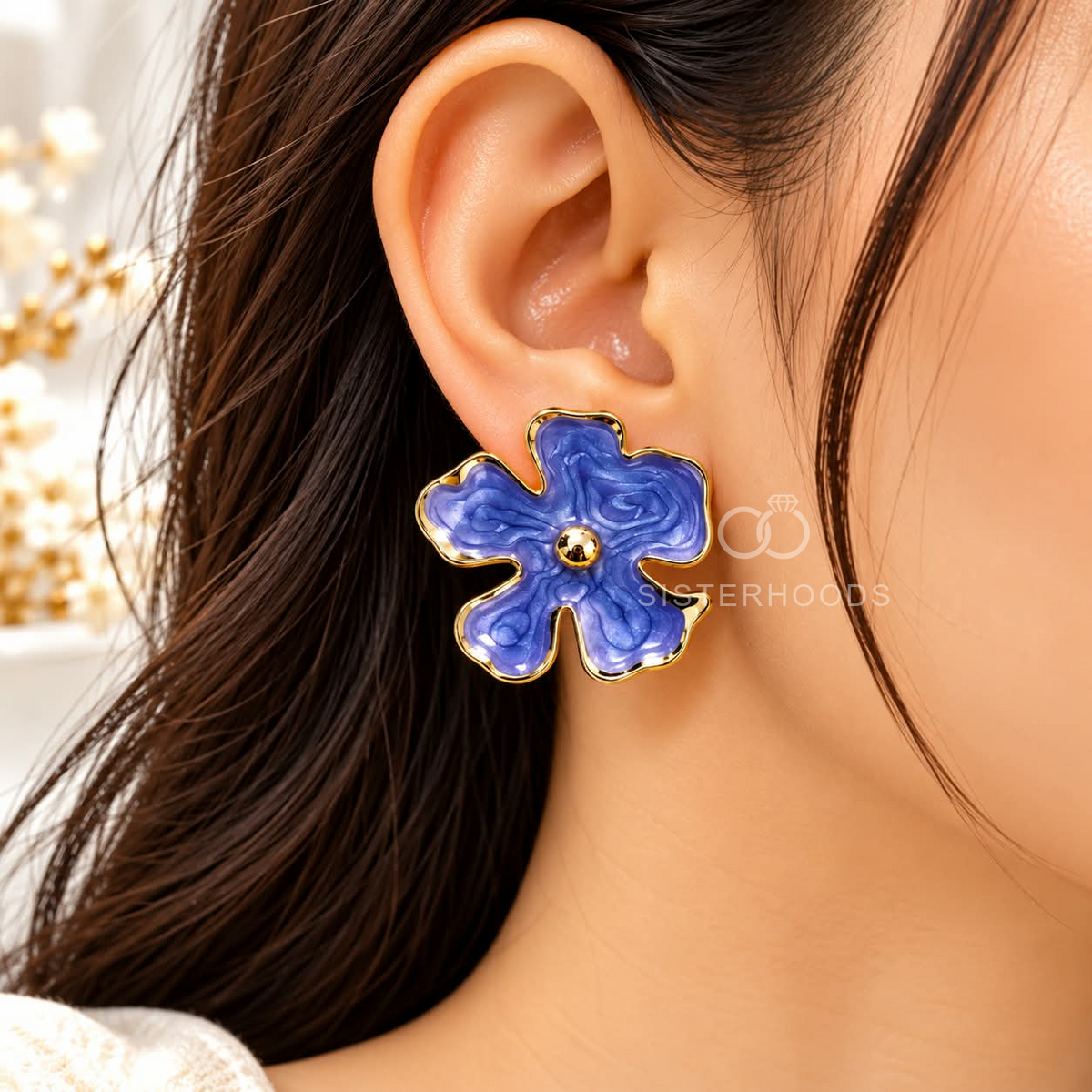 Blue floral stud earrings with gold-tone outlines and rounded petal details | SISTERHOODS-SHA256:ce05025e985198c781a534d9a2cad2949d734e5762aa0cf12520cb0479df37a0