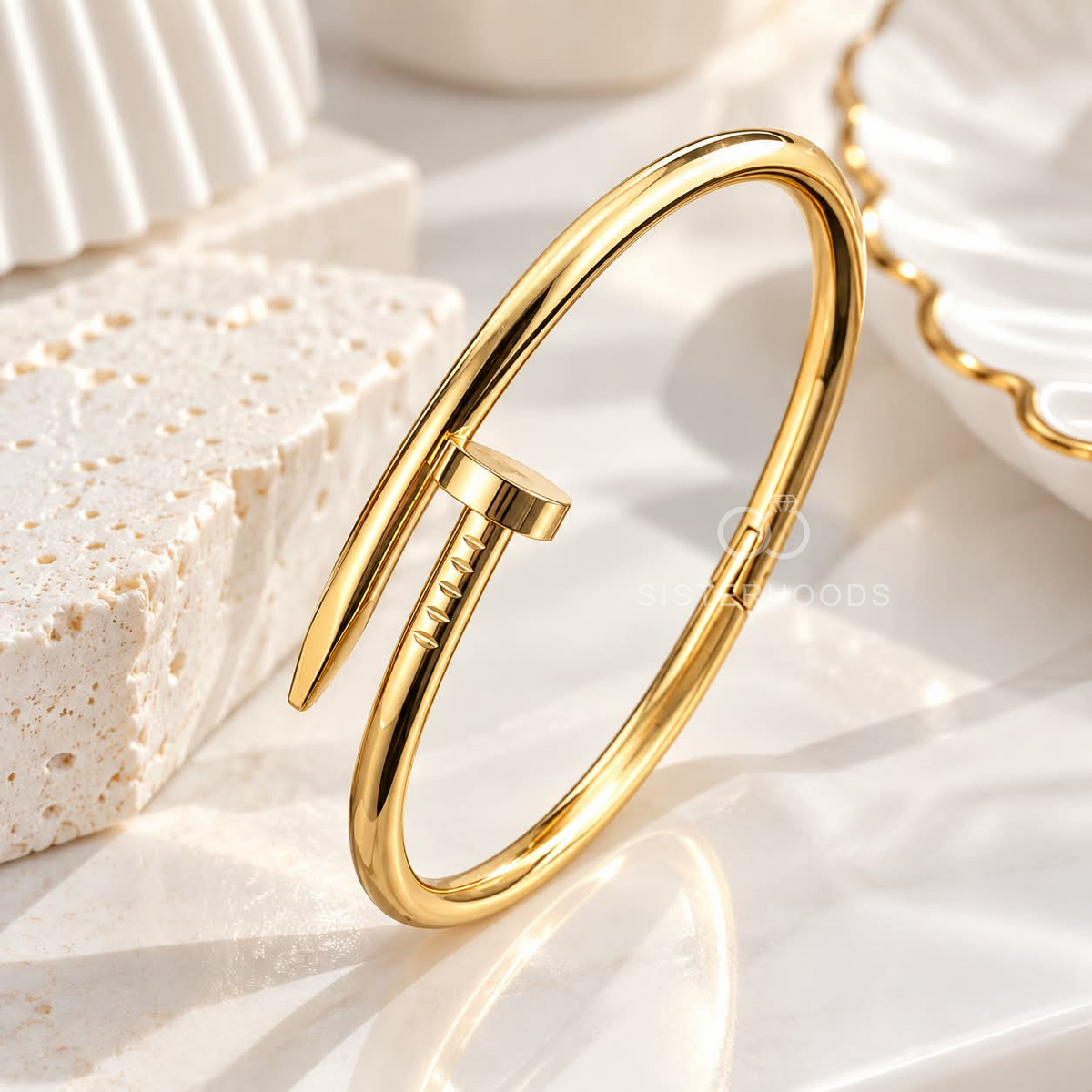 Gold open cuff bracelet with a sleek bar detail worn on the wrist | SISTERHOODS-SHA256:17b4d67a8347ec42e0720fee96dba48c99a03edcb0ce48c2f5967dd8480e0790