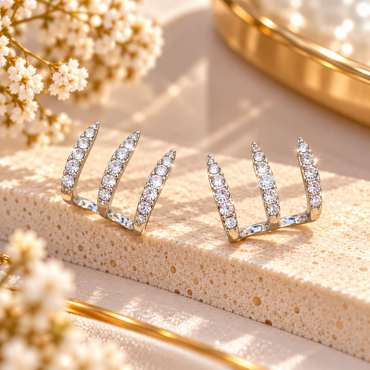 Gold-tone curved stud earrings with rows of clear stones | SISTERHOODS-SHA256:544123d12c7be4c6dd18956ce69e4c757d2475489cb4cf1192f26dd1f8d49c88