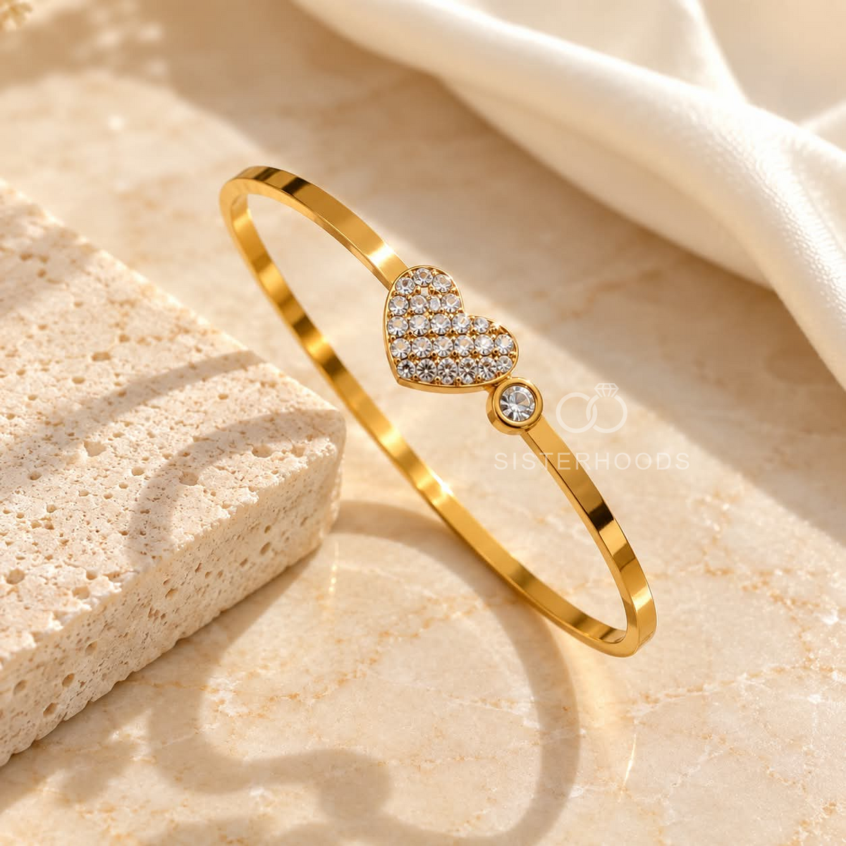 Gold-tone cuff bracelet with sparkling heart and round accents | SISTERHOODS-SHA256:b9e68c1014bf813e73edded4ab4795c6b55b20a3540b06ed1dd90a97dde27517