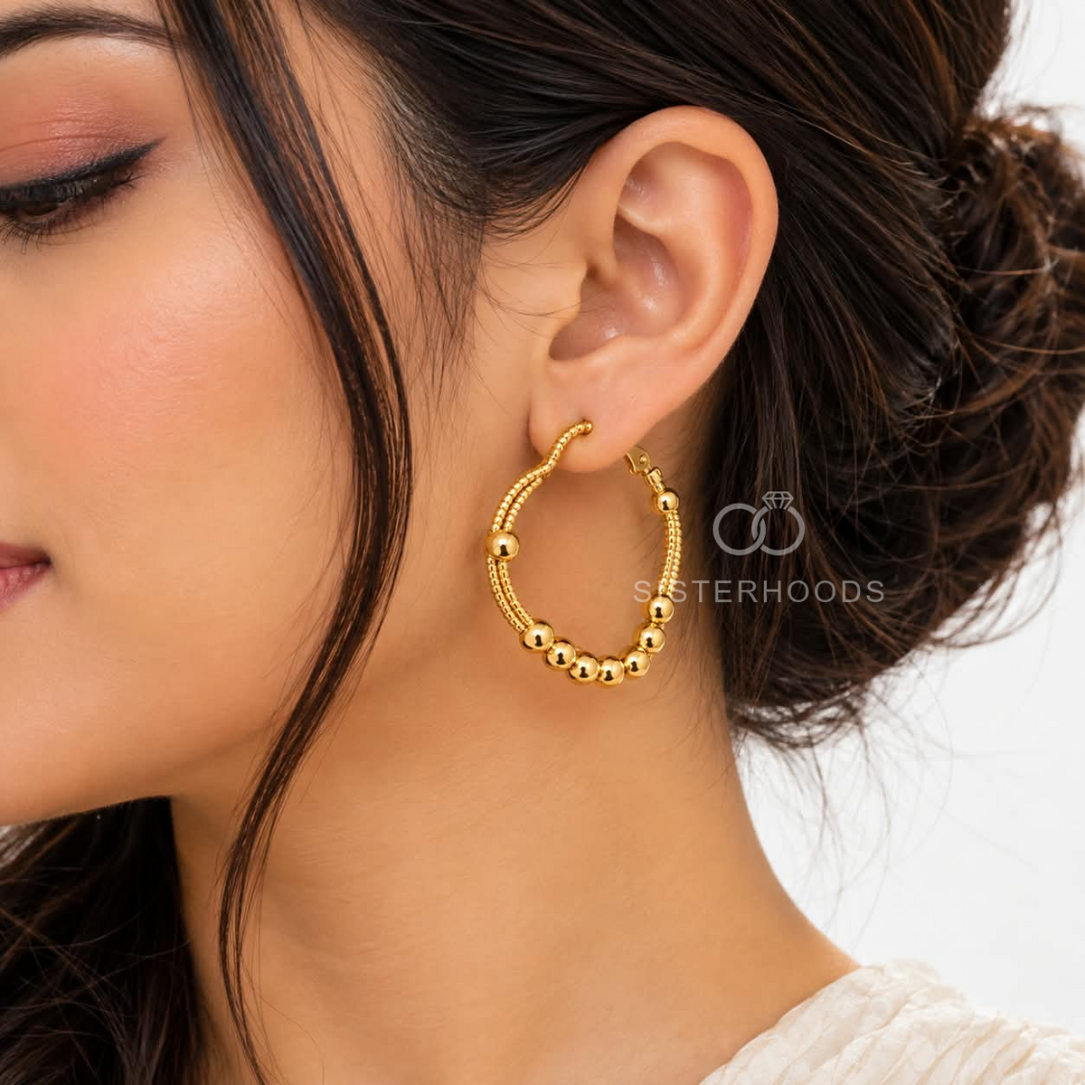 Gold-tone beaded hoop earrings with rounded silhouettes | SISTERHOODS-SHA256:1d2cddd25f6a3fd2c11b90b4432c0625c146a4ade533f080afb9d8135be3609d