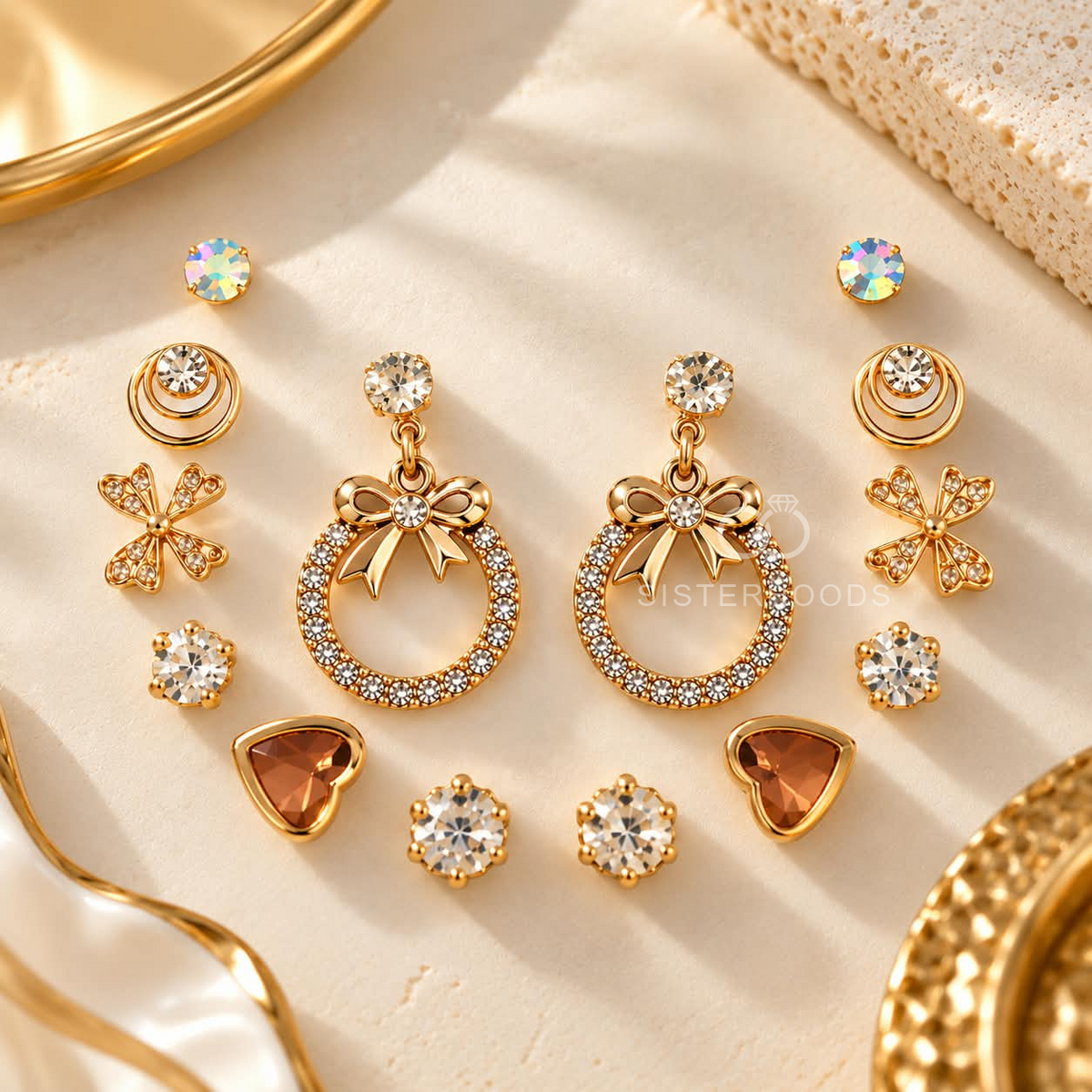 Gold-tone multi-style earring set with studs, bow drops, floral accents and heart-shaped designs | SISTERHOODS-SHA256:9c2db74a85824132948847651dd8a0a11b00d3214bea2e071bd4c47d9fce5c3a