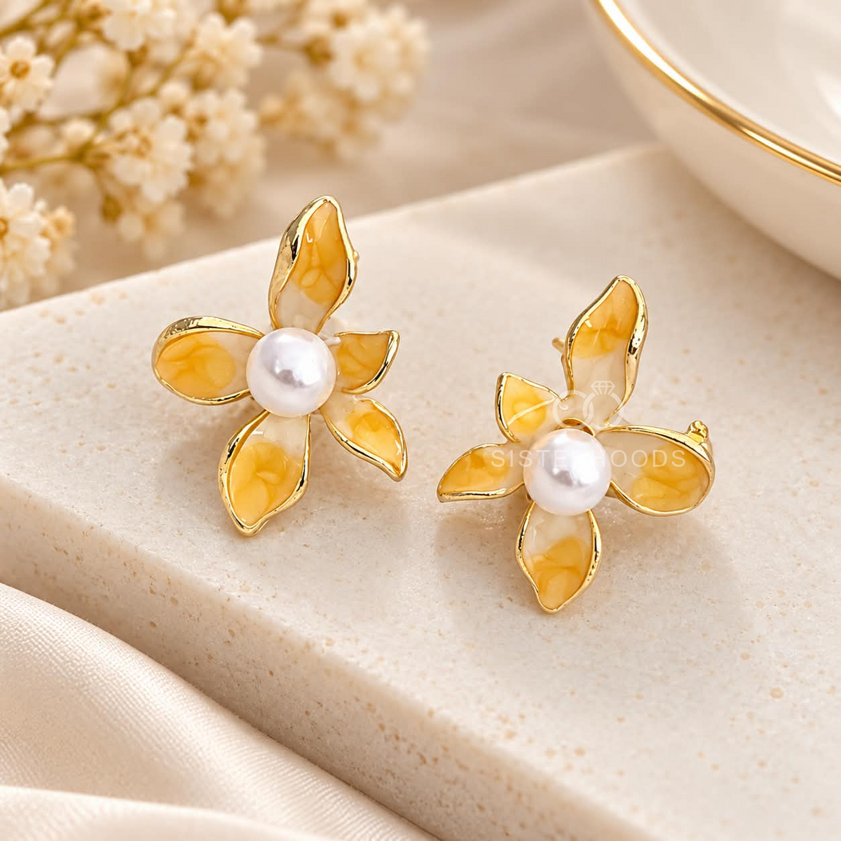 Yellow floral stud earrings with pearl-inspired centres | SISTERHOODS-SHA256:a78d333f98094d397e59781797efe592190a8c36f17f2ac5edbbc7be0aa983c3