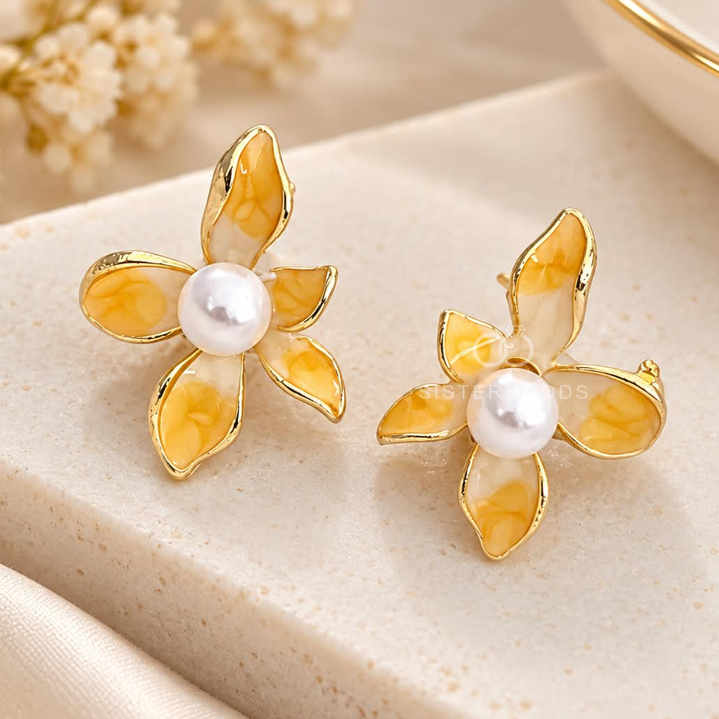 Yellow floral stud earrings with pearl-inspired centres | SISTERHOODS-SHA256:d2a846f23428475fcd1744b5542487d1ac269e54d4ba54e17390f51964d1db9b
