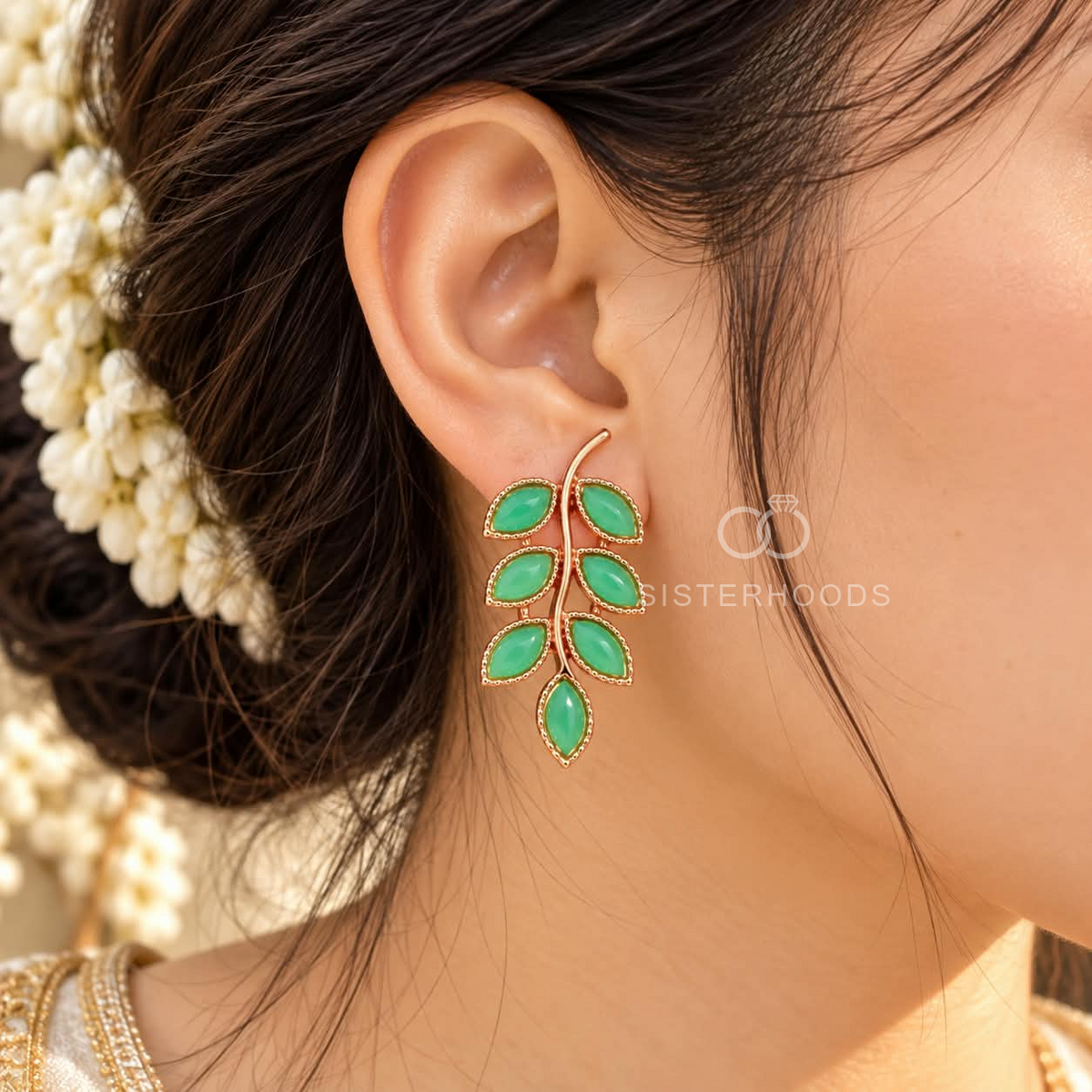 Green leaf-shaped dangle earrings with a graceful curved stem design | SISTERHOODS-SHA256:4fe894842e4df32b7eec0e3e9817fe171924bd7a3a6e89f2b921f8f00bfedc2b