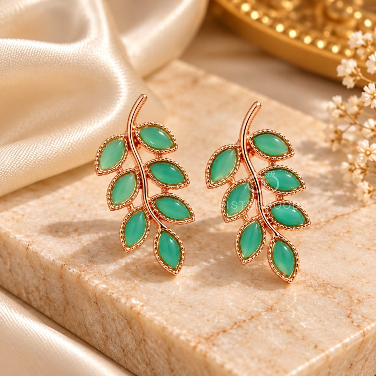 Green leaf-shaped dangle earrings with a graceful curved stem design | SISTERHOODS-SHA256:531ff7f5edf1f0b9eae3d5af7a33e165f30bc33c86439b3f9f39d56a70f4a224