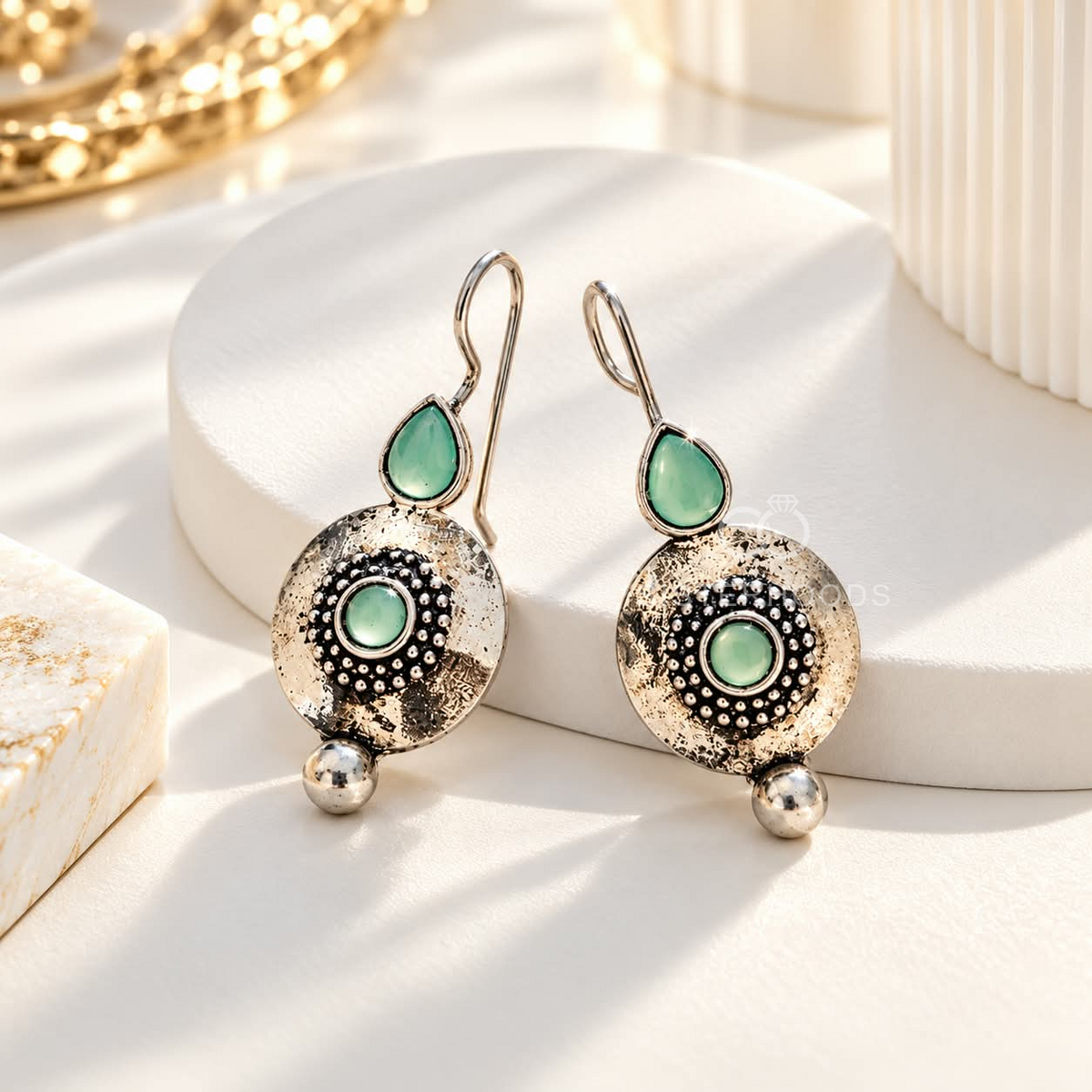 Silver-tone dangle earrings with green accents, textured circular centres and small round drops | SISTERHOODS-SHA256:1fb4175ab1f1d4c9c81a11f5e49e2494a60721b4eda855f7b9d9a4360227906f