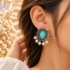 Teal oval oxidized dangle earrings with ornate detailing and white bead fringe | SISTERHOODS-SHA256:bb670b541de19c7e239087b09e3027192c29faf4e0814e13ad5e917f2b135ed6