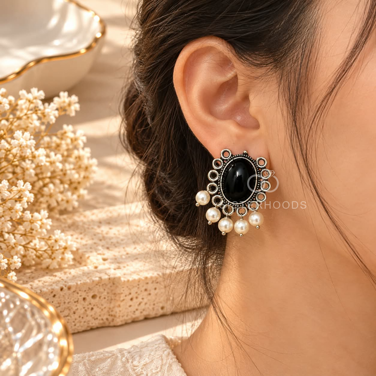 Black oval dangle earrings with ornate silver-toned detailing and white bead drops | SISTERHOODS-SHA256:774f8b2f3c7773ef41cb9b467f44c2c3e30f9b017283b17e6858406d48250aeb