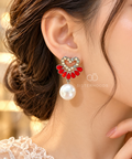 Heart-shaped dangle earring with red petal accents and a white pearl drop | SISTERHOODS-SHA256:0f7183f69bb278ce96ce23eba896e258c33ba64902f32261dbb4617f1e187c07