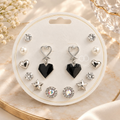 Multi-pair silver earring set with black heart, star, pearl-style and sparkling stud designs | SISTERHOODS-SHA256:122e24189988cfc60e5faed176c4148b53ff0d199b9929e1a3619c5d75c90750