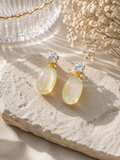 Gold-colour earrings with sparkling round studs and iridescent oval drops. | SISTERHOODS-SHA256:aca060a52a0ad86e5a23f81085a8c75d91609a0d4d29afdd8ef26641d08724af