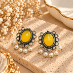 Mustard oval oxidized dangle earrings with ornate detailing and ivory bead drops | SISTERHOODS-SHA256:013e50e9375c9d93848404aa873f5acbf79b92c54657aa09cee84301e53e2160