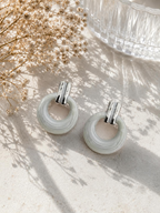 Ivory circular hoop earrings with silver-tone rectangular tops | SISTERHOODS-SHA256:e1ebe06436c3351b2d17884dbc964b8abdc6231dc102819b2e6563ddcb0f3132
