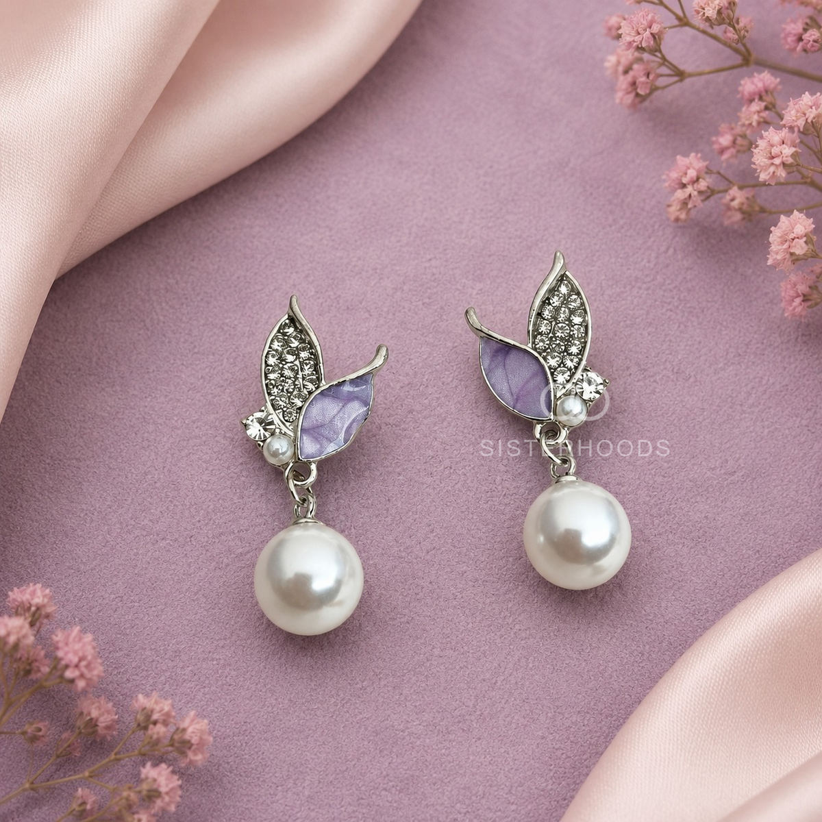 Silver and lavender leaf drop earrings with white round dangling accents | SISTERHOODS-SHA256:8f45e1bcb2aaa67428541aad9467bf8d0d5b46fccf9b6d79fb0473655786d43b
