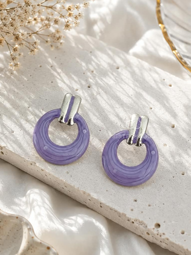 Lavender circular hoop earrings with silver-tone accents | SISTERHOODS-SHA256:f98eeaefc788eed6286e6f44c699ea309bd12b6f43b1cc75c665408e0d7ee4cc