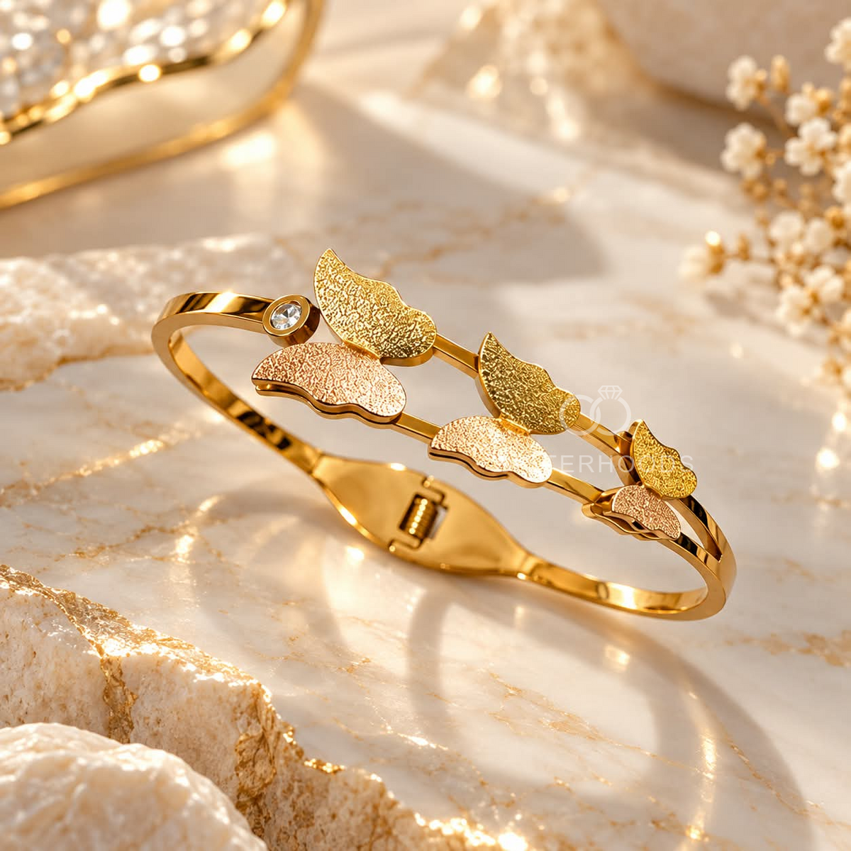 Golden cuff bracelet with textured petal motifs and rose-toned accents | SISTERHOODS-SHA256:283ebdcddf4721dafbb35a5fa34e359b8dce291143041e9afcae25a65968d991