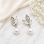 Silver leaf drop earrings with white round bead accents and sparkling details | SISTERHOODS-SHA256:5a93876c0299fd1185106f62c7a382917cca55106ac2b21200a88e41424b735b