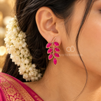 Magenta leaf-shaped botanical stud earrings with rose-gold-toned detailing | SISTERHOODS-SHA256:ed5b05ac59c01cb47eb4044cc98d7f78476d49b4bed6f9a3d908c213ae959914