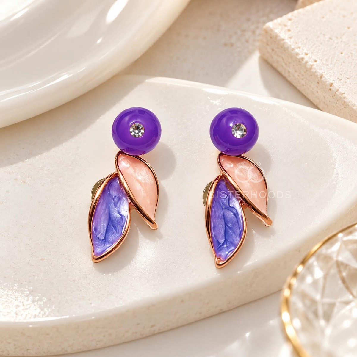 Purple and pink layered leaf dangle earrings with clear centre accents | SISTERHOODS-SHA256:fd9a3c633d0c64b92e1fd2a325bc51469bef84ee9cb7543a3031c861d2a3acc9