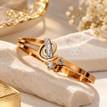 Gold-tone open bracelet with geometric details and crystal accents | SISTERHOODS-SHA256:d3c0a06d6c88b1d8107bc3fd3b50558511956ae9f31317517cd5c055a311344a