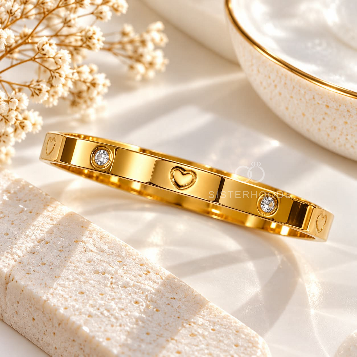 Gold tone cuff bracelet with heart motifs and clear crystal accents | SISTERHOODS-SHA256:c38e1457aac068a2f3d208da61f7c553d9547c00b4b125c34d2f5a350495be93