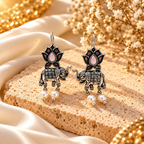 Oxidized elephant and lotus dangle earrings with black, pink and pearl-like accents | SISTERHOODS-SHA256:d227f3bb411224d299fe2500359a639d0bc3daf1d115d65e06ad1d81bb97d1b3