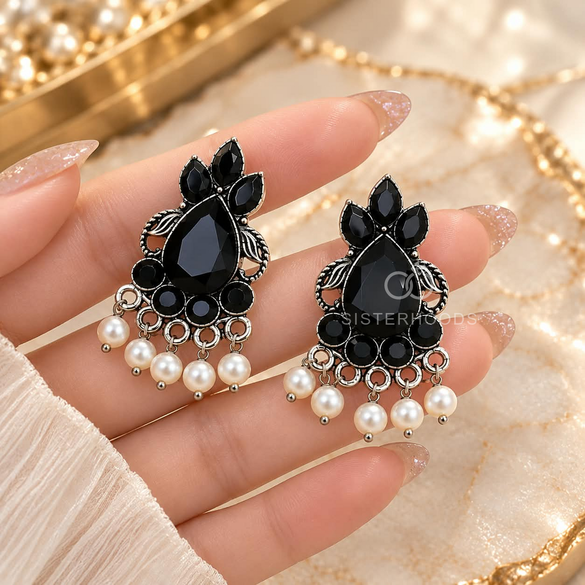 Black floral dangle earrings with silver-toned detailing and white bead accents | SISTERHOODS-SHA256:aa2b40b450daa663e6a03f8121f1b6b8c08faa73074b7a9051ce078665b537ef